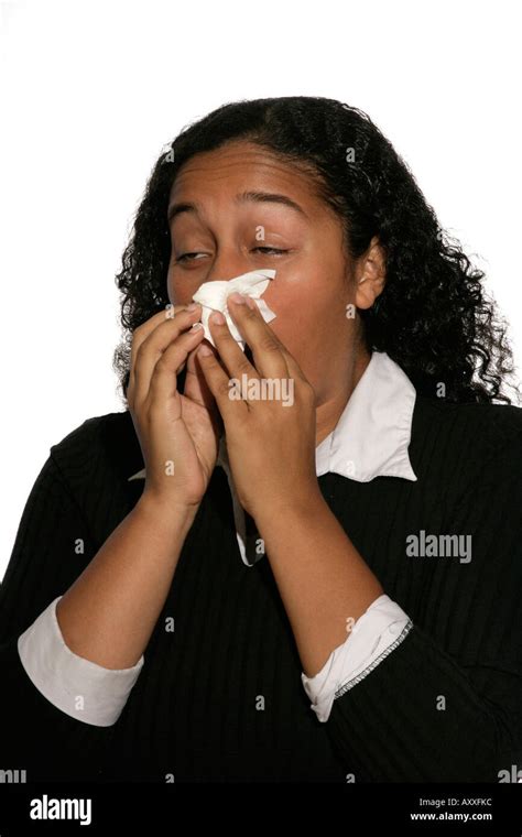 Woman Blows Her Nose Using Tissue Stock Photo Alamy