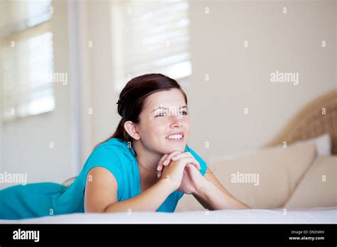 Teen Girl Lying On Her Bed And Daydreaming Stock Photo Alamy