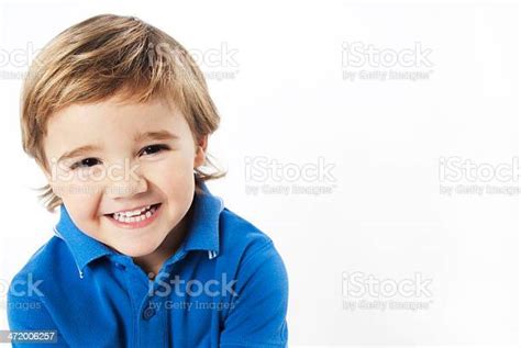 Smiling Little Blond Boy With Blue Shirt Stock Photo Download Image