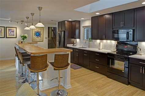 An island can add whatever you need more of to your kitchen, whether it is work space, storage, seating or all three.having table or bar seating is great for. Contemporary Galley Kitchen with Island Seating ...