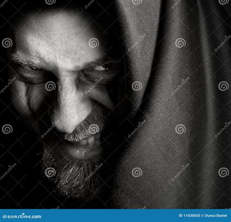 Evil Sinister Man With Malefic Wicked Grin Royalty Free Stock Photo