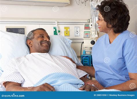 Nurse Talking To Senior Male Patient On Ward Stock Photo Image Of