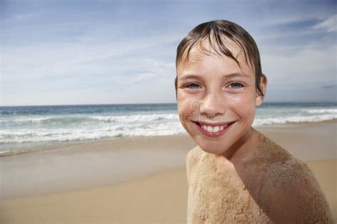 Boy Covered In Sand Smiling On Beach Stock Photo Image Of Head