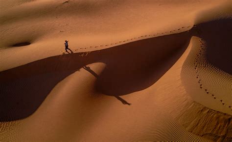 Person Walking On Desert · Free Stock Photo