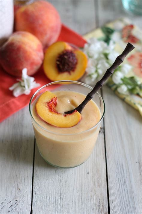 A Smoothie In A Glass With Peaches On The Side
