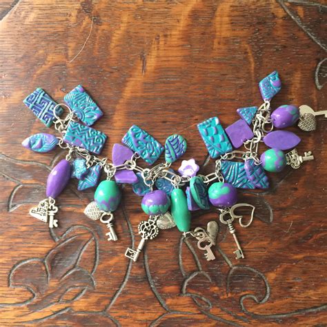 Polymer Clay Charm Bracelet With Silver Charms Purple And Turquoise