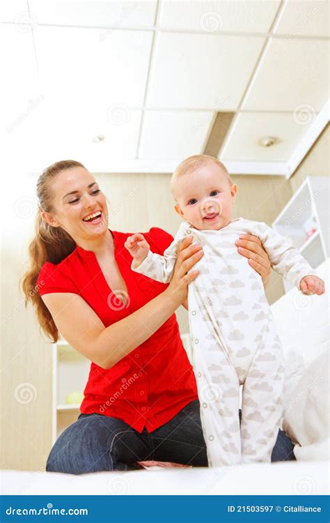 Smiling Mother Helping Baby Learn To Walk Stock Image Image Of