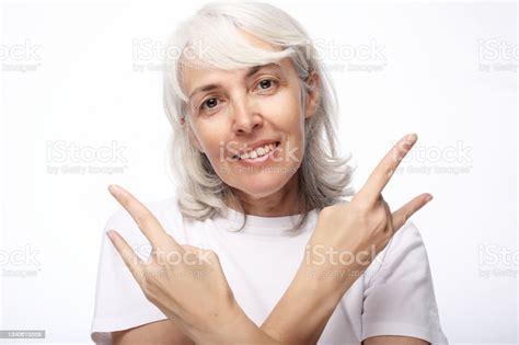 Old Woman Laugh And Showing Peace Or Victory Signat Camera Emotion And