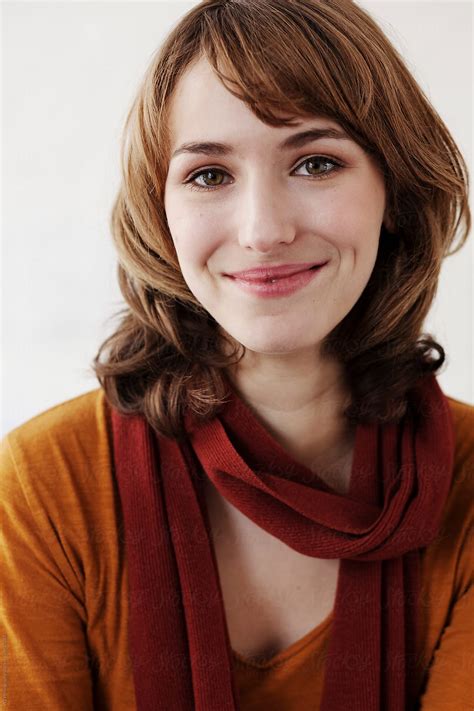 Portrait Of Beautiful Woman In Orange Sweater By Stocksy Contributor