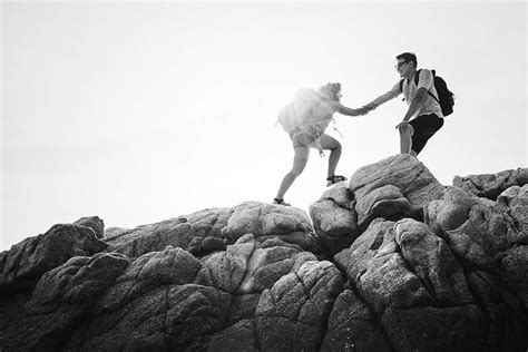 Friends Helping Each Other Up A Mountain Premium Photo Rawpixel