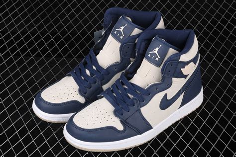 Arriving as a blend between neutrals and vibrant tones, this specific variation pairs dark navy tongues, toe boxes, and quarter panels with swooshes and overlays dialed to white finishes, while the ankle collars complement with laser. Air Jordan 1 Mid Navy Blue And White - Almanusa