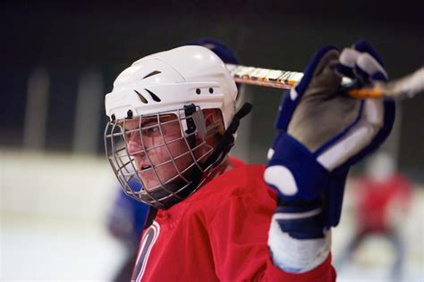 Premium Photo Young Ice Hockey Player Portrait On Training In Black