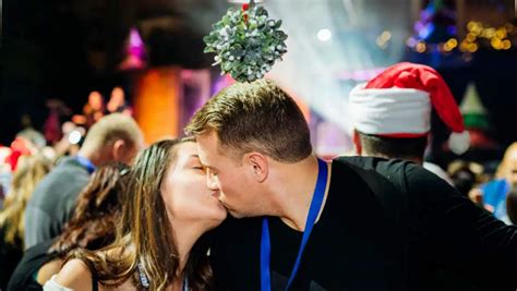 hundreds of couples get close under the mistletoe for kissing record attempt guinness world