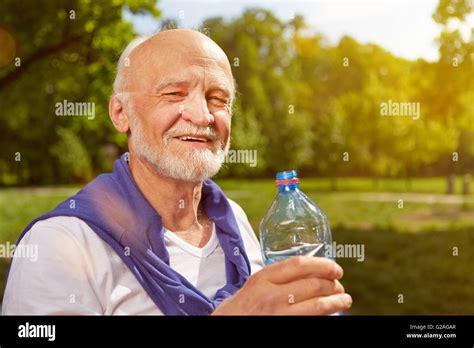 Thirsty Senior Man Drinking Fresh Water After Sports Stock Photo Alamy