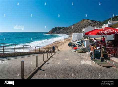 Beach In The Fishing Village Of Burgau In The Algarve Portugal Stock