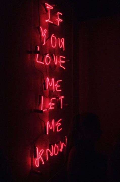 a red neon sign that says if your love me let me know on the wall