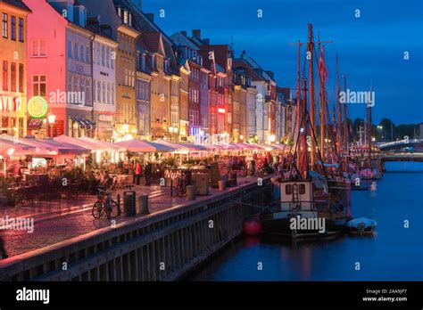 Nyhavn Copenhagen Evening View Of The Waterfront Area Of Bars And