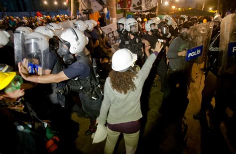 Riot Police Fire Water Cannons And Tear Gas To Drive Protesters Out Of