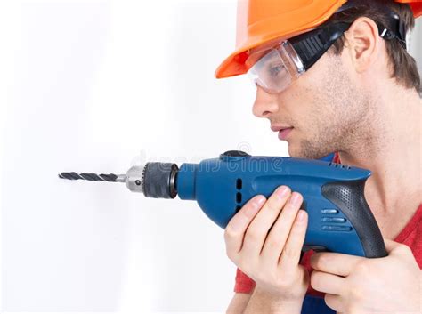 A Man Drilling A Hole In The Wall Stock Photo Image Of Handyman