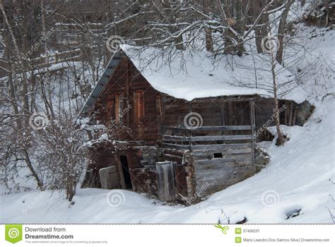 Winter Old And Abandoned Log Cabin In The Alps Stock Image