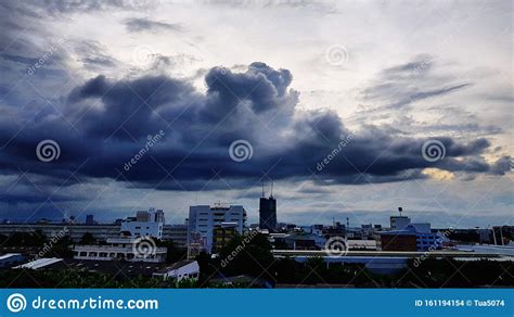 Scenic View Of Cityscape Against Storm Clouds Stock Photo Image Of