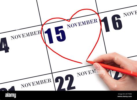 15th Day Of November A Womans Hand Drawing A Red Heart Shape On The