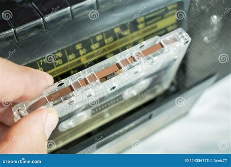 Insert An Audio Cassette Into A Tape Recorder Stock Image Image Of