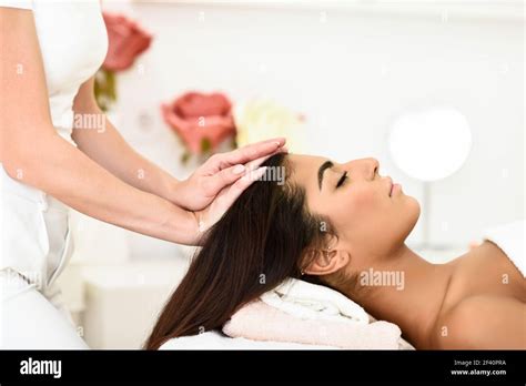 arab woman receiving head massage in spa wellness center beauty and aesthetic concepts woman