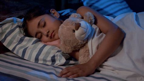 Cute Little Girl Sleeping In Her Bed With Her Soft Toy Night