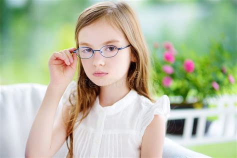 Portrait Of Cute Little Girl Wearing Glasses At Home Vision Health