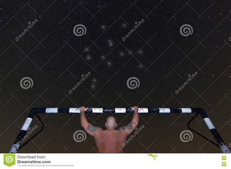 Man Doing Pull Up Under Starry Night Dark Night Training Hercules Constellation Stock Image