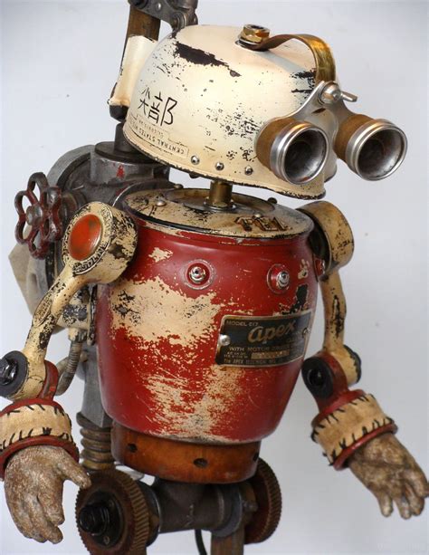 An Old Fashioned Robot Is Holding A Red Bucket