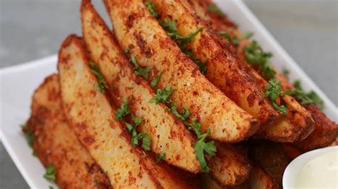 This is a lot of potato. Baked Garlic Parmesan Potato Wedges!!! - Tomato Hero