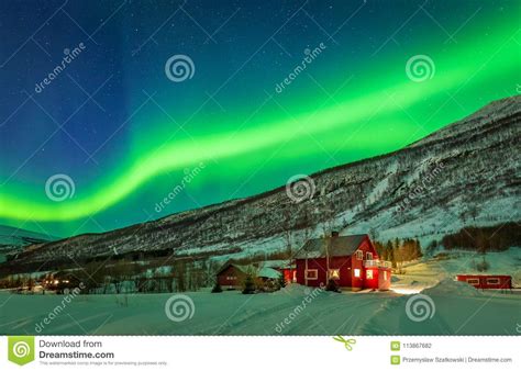 Green Northern Lights Over Rural County Of Northern Norway Stock Photo