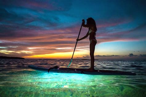 stand up paddleboarding under the stars