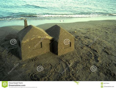 Sand House On The Beach At Sunset Summer Time Vacation Stock Photo