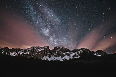 Snow Covered Mountain Under Starry Night Photo Free Image On Unsplash
