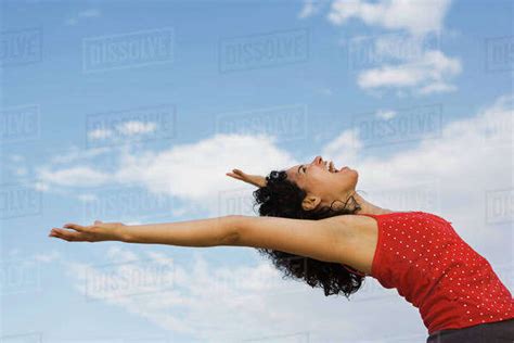 Young Woman Bending Over Backwards Laughing Stock Photo Dissolve