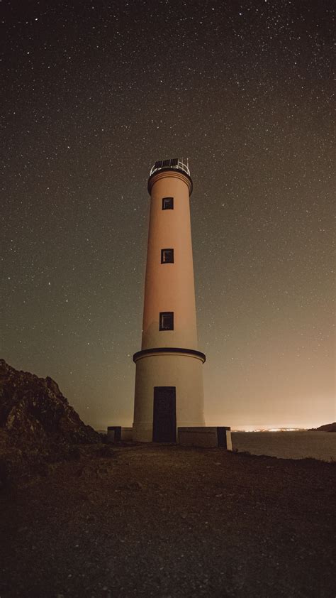 Download Wallpaper 1080x1920 Lighthouse Building Starry Sky Stars