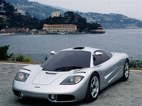 how elon musk s car collection has evolved over the years from the million dollar mclaren f1 he