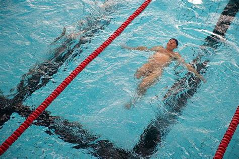 A Man Performs During A Naturist Swimming Championship On October 25