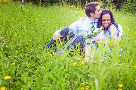 Couple Having A Candid Romantic Kiss In The Grass Stock Image Image Of Couple Embracing 12526887