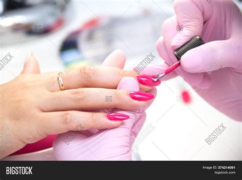 manicurist apply nail image and photo free trial bigstock