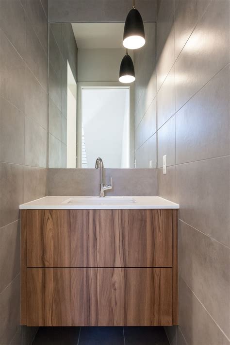 Fully Tiled Contemporary Powder Room With Floating Vertical Grain