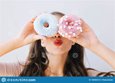 Closeup Portrait Joyful Girl With Red Lips Having Fun With Colorful Donuts Against Her Eyes