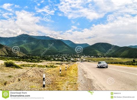 Landscape Of Asphalt Road Going Off Into The Mountain Passes Through