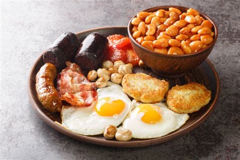 Full Fry Up English Breakfast With Fried Eggs Sausages Bacon Black Pudding Beans Tomato
