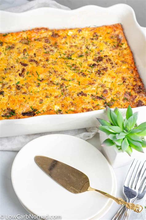 Sausage, bacon & veggies nestled in a fluffy, cheesy egg bake. Easy Low Carb Breakfast Casserole with Eggs, Bacon, Cheese and Sausage • Low Carb Nomad