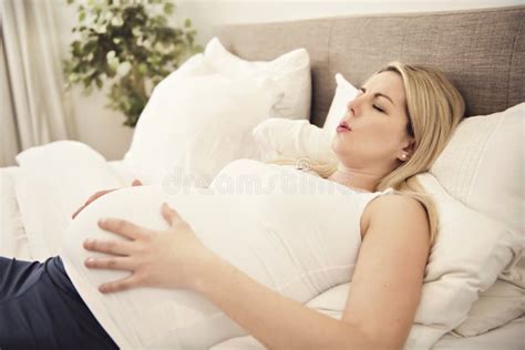 Pregnant Woman On The Bed At Home Having Contractions Stock Image Image Of Hand Human 199520367