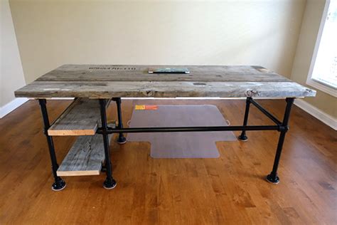 Diy desk with industrial pipe this amazing deck is made up of two parts, the desktop which is made of wood, and the legs which are made of steel pipe fittings. Reclaimed Wood Pipe Desk with Side Shelves Desk Week